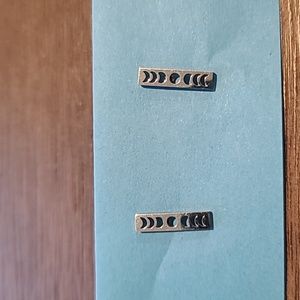 Silver tone moon phases earrings